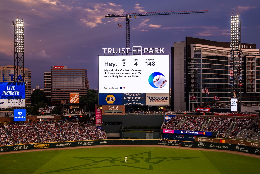 Truist Park at dusk, the scoreboard showing a Google Cloud insight for seat 3, row 4, section 148